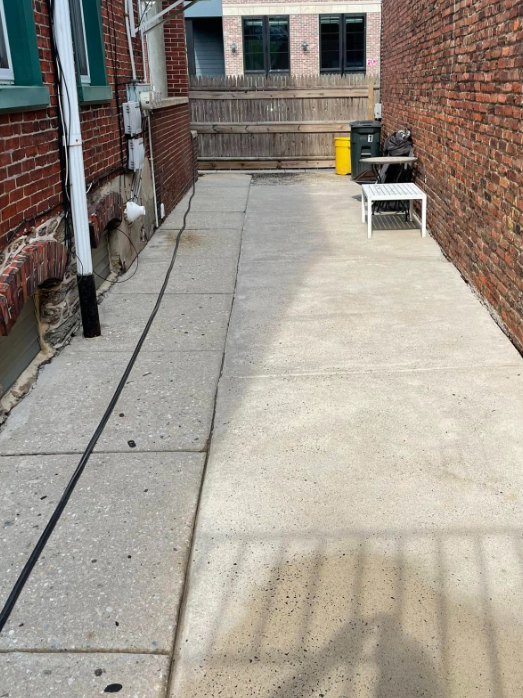 Concrete patio walkway before cleaning